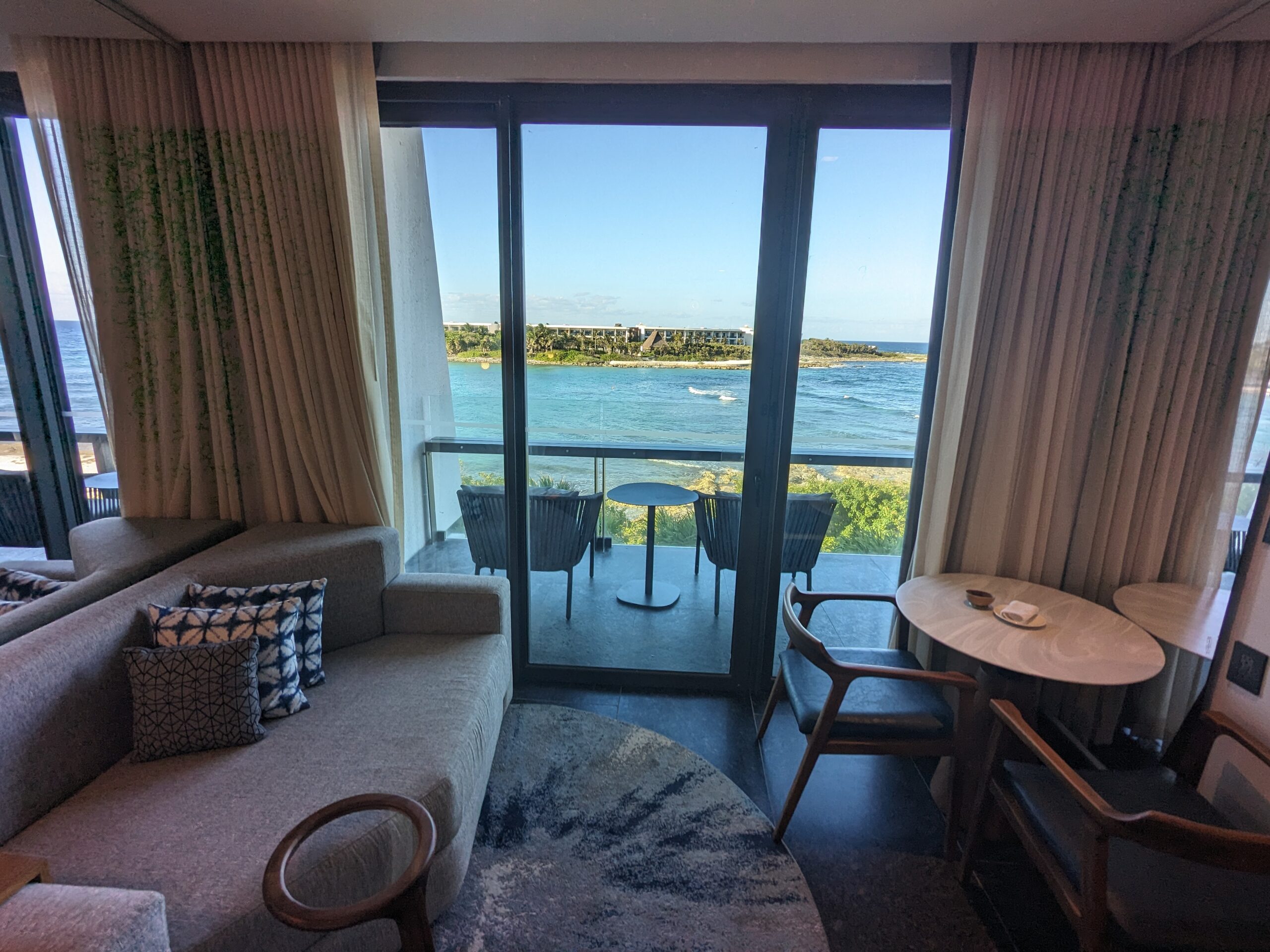 Conrad Tulum loveseat and table