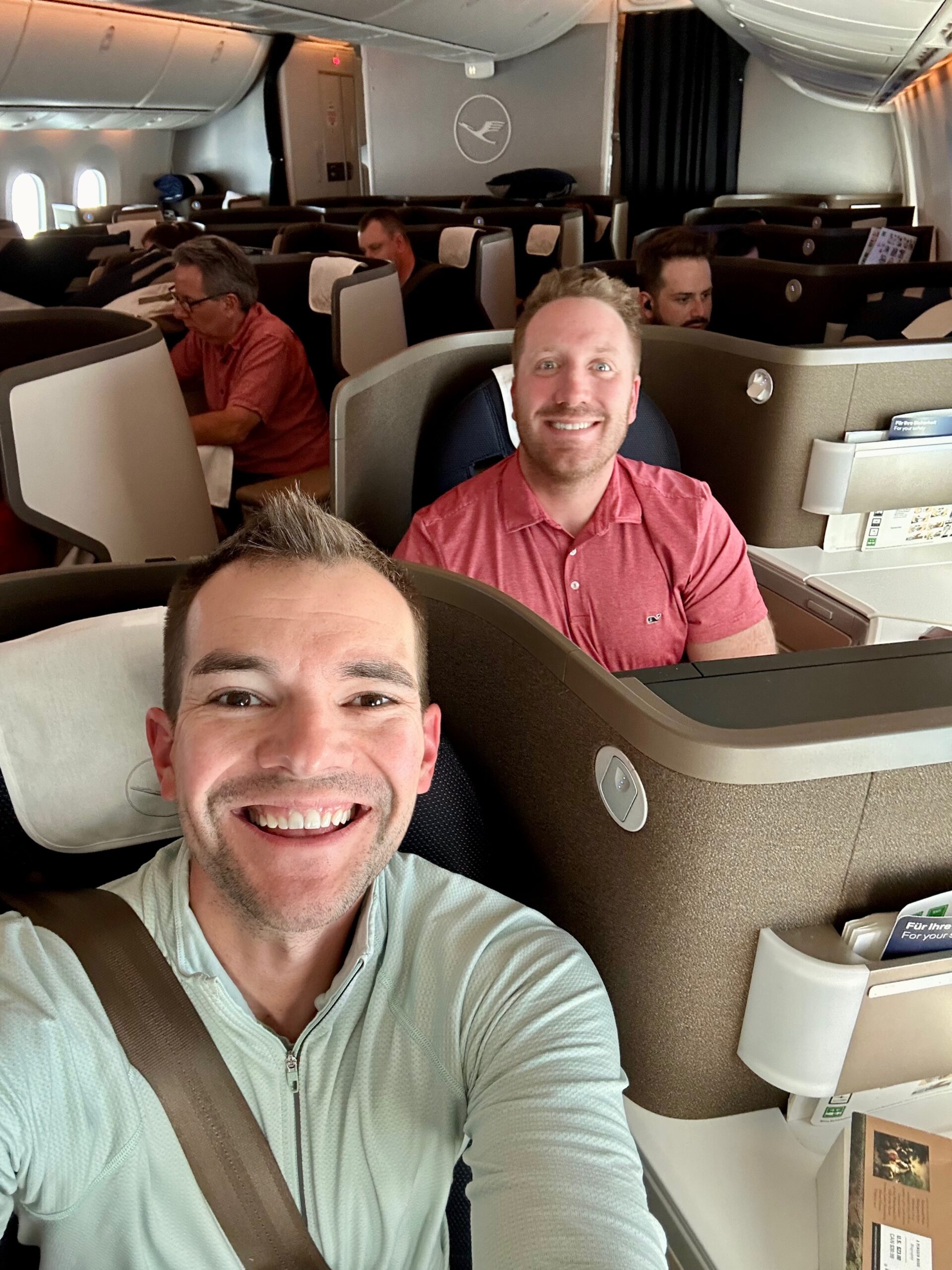 two men in lufthansa business class