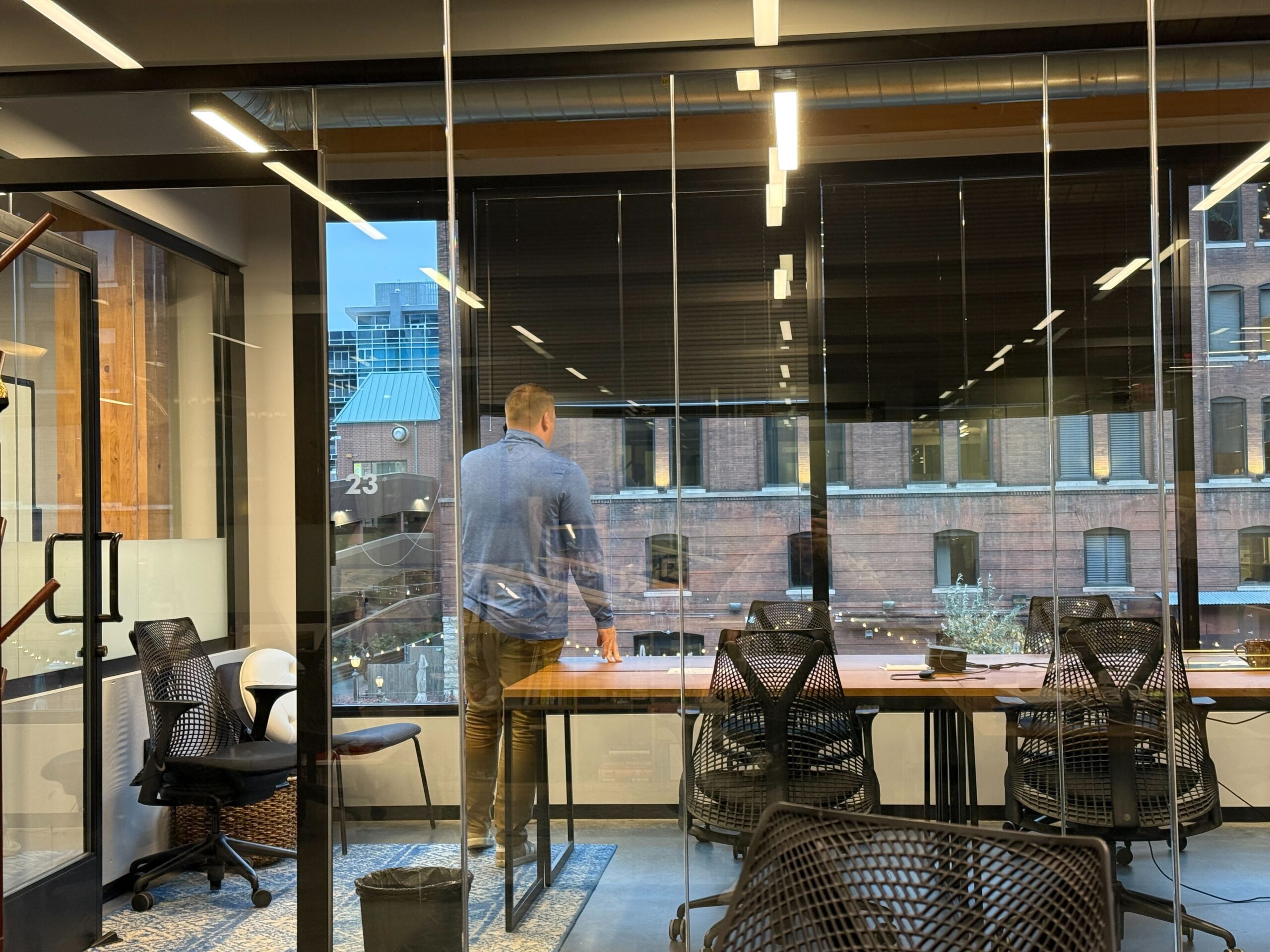 photo of a man standing inside a conference room