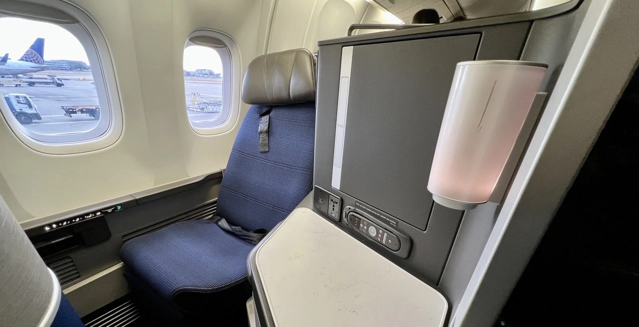a business class seat in the united polaris cabin