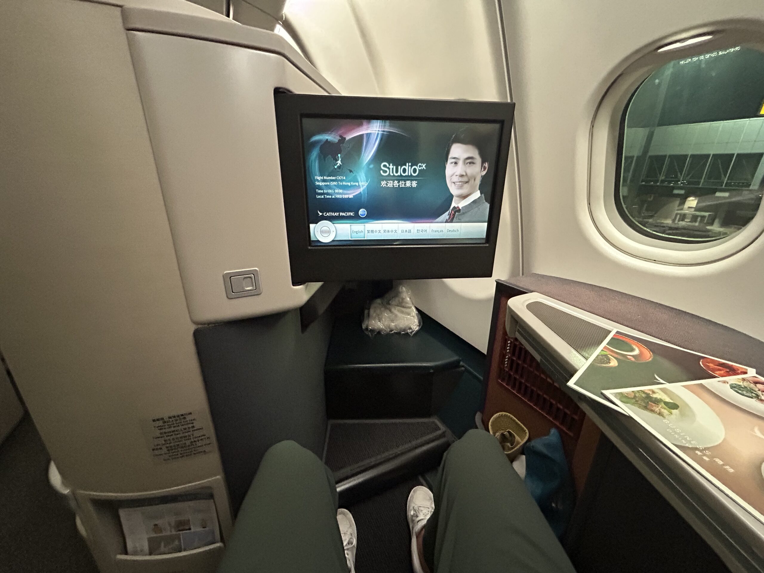 monitor pulled out from the back of an airplane seat