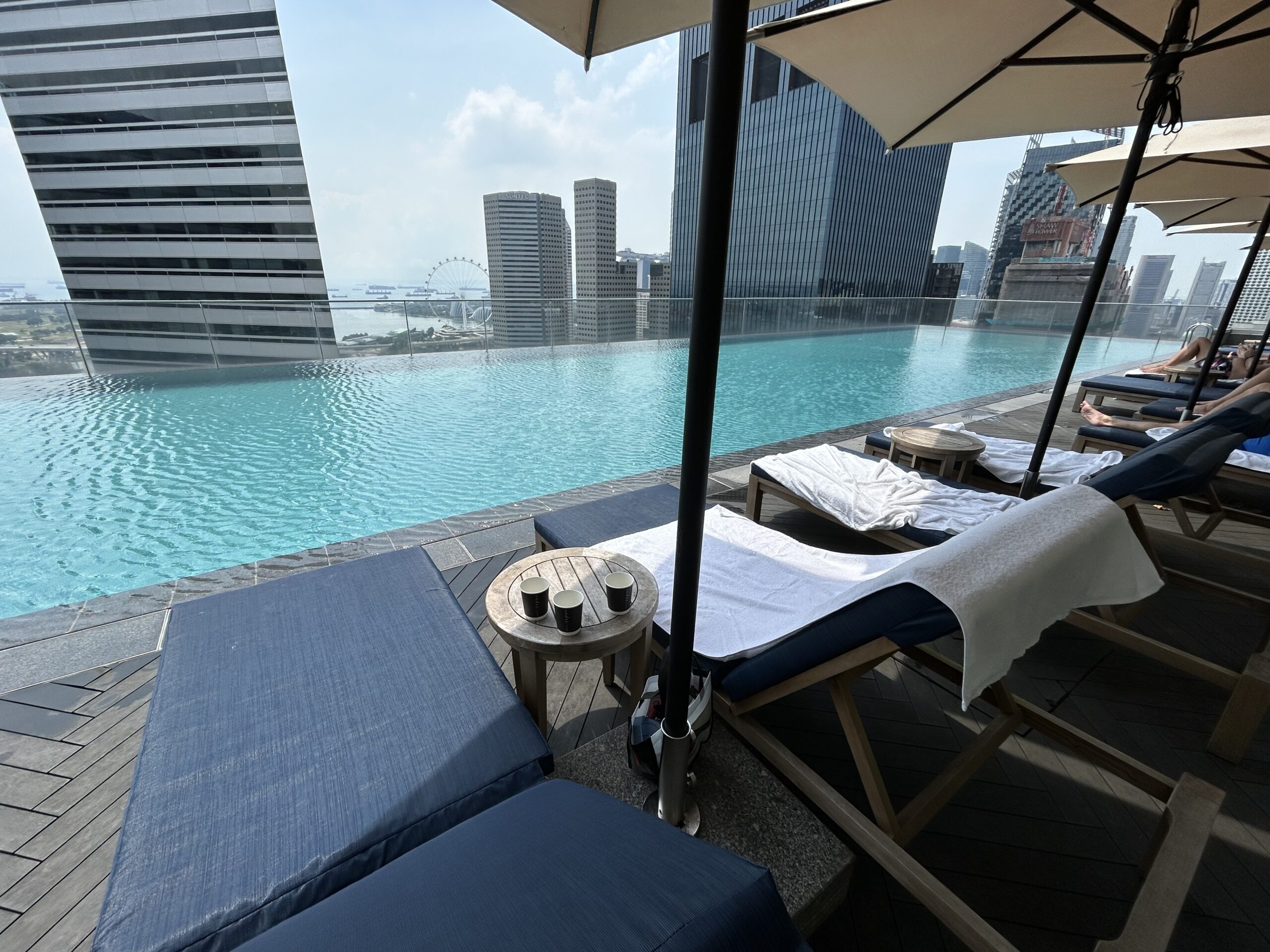 Poolside chairs at a rooftop hotel pool