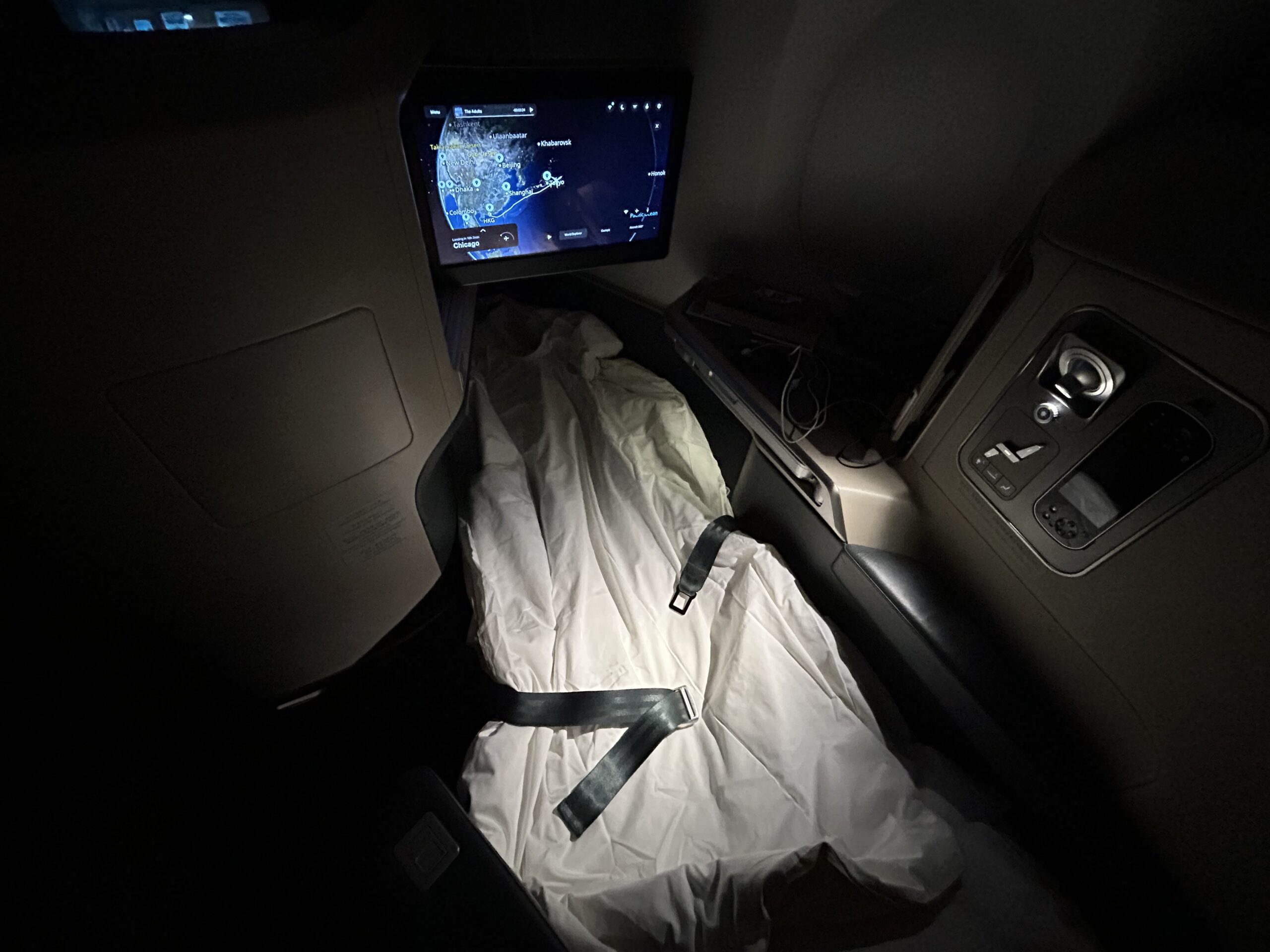 A seat in bed mode in business class