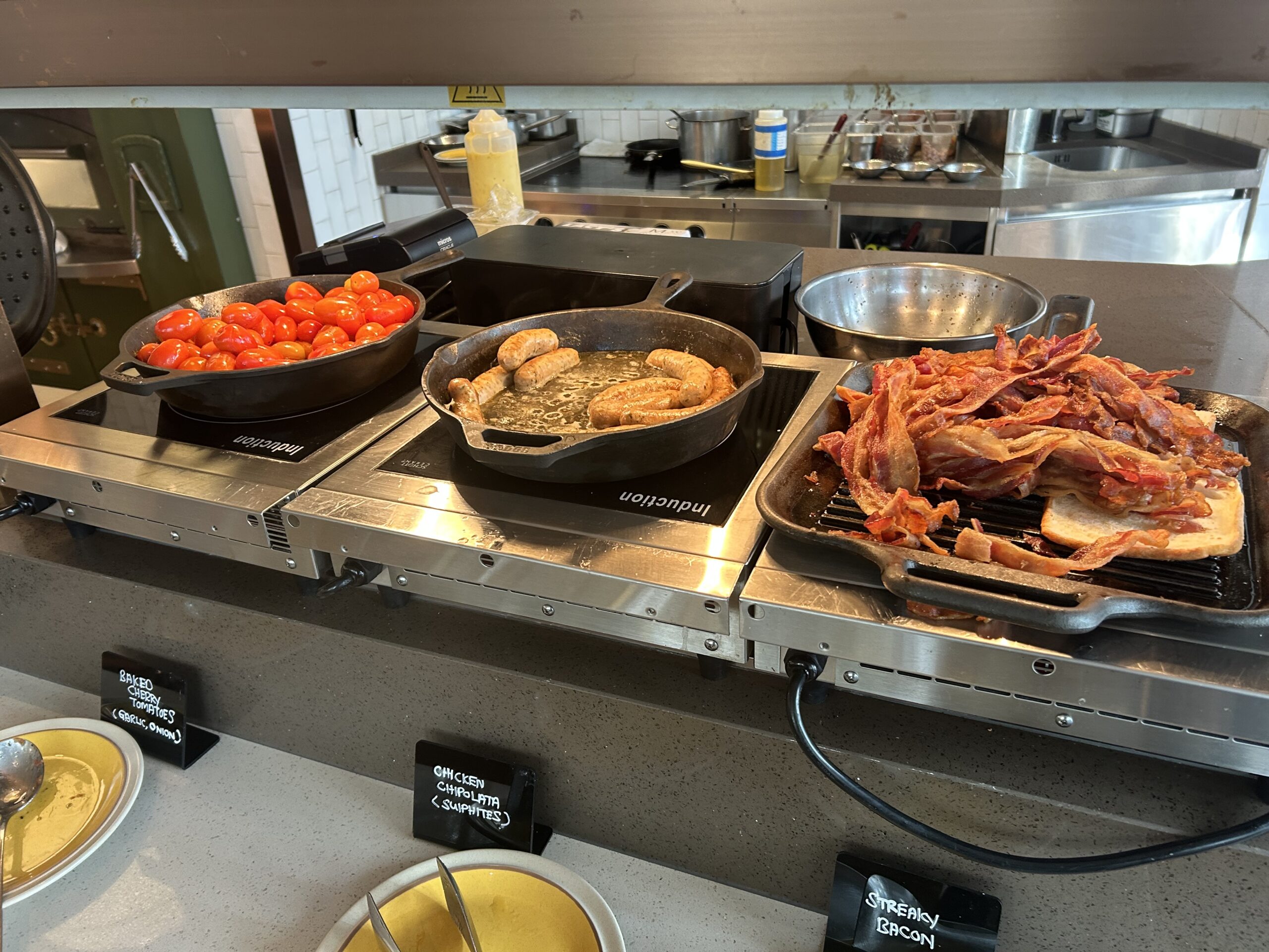 cast-iron skillets with various breakfast dishes