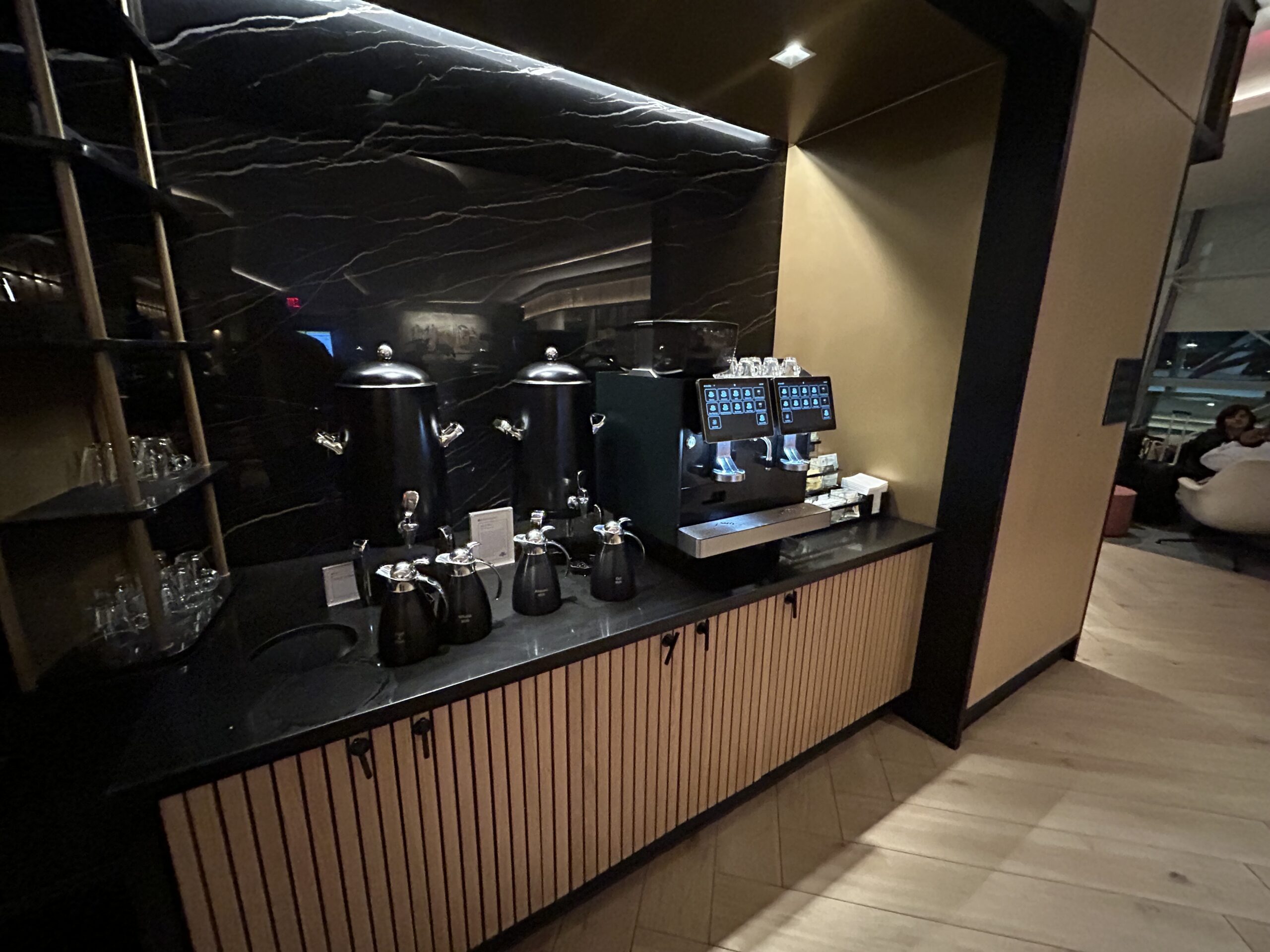 Coffee machines and carafes on a counter. 