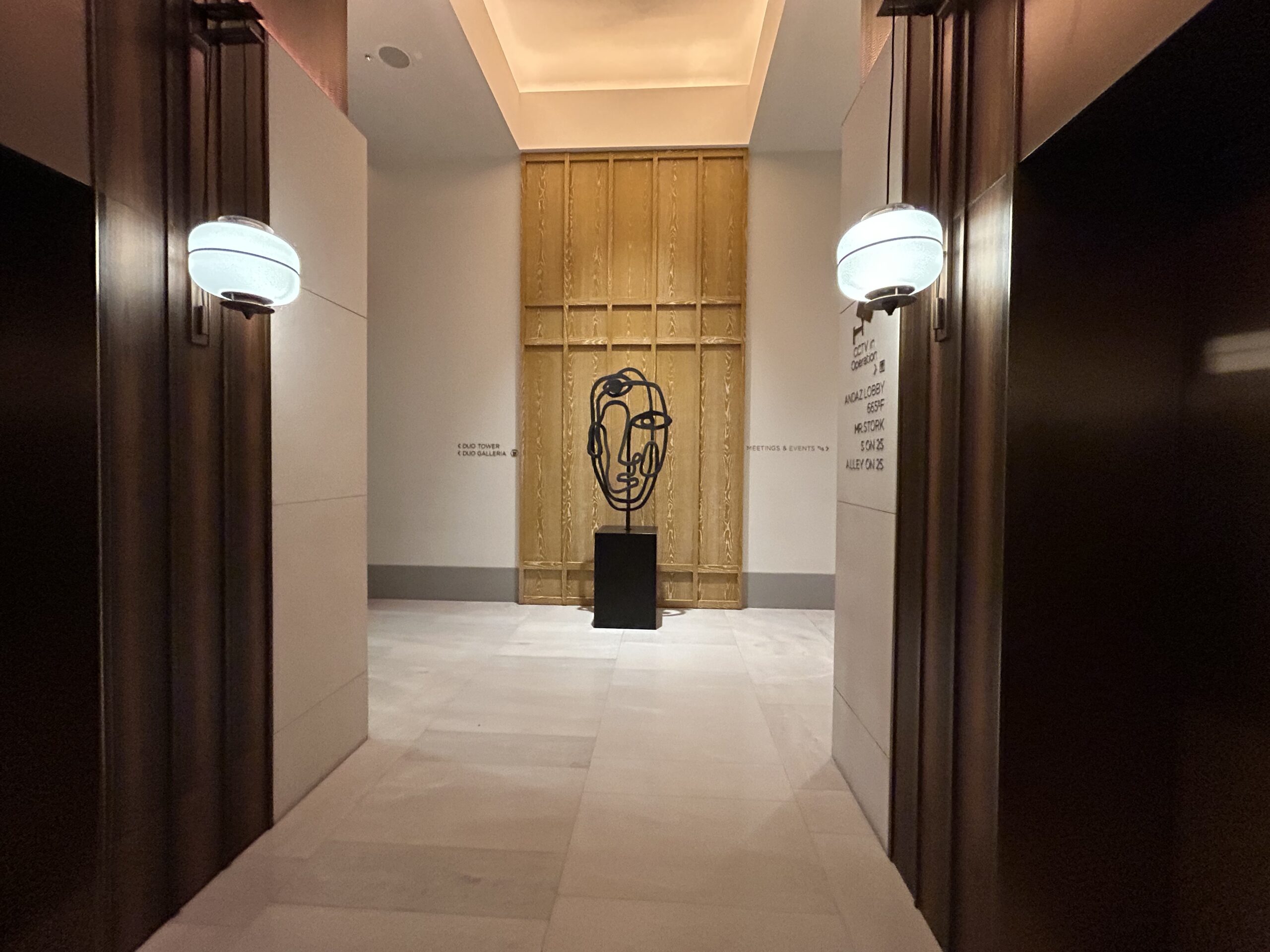a sculpture and lights in the Andaz Singapore lobby 