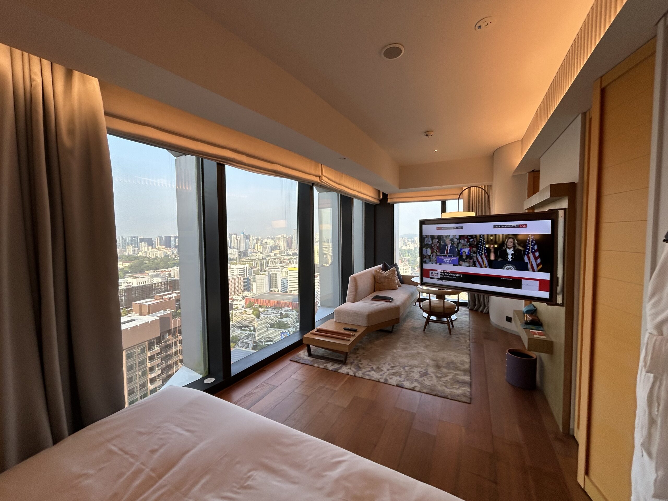 TV swivels out to face bed in hotel room