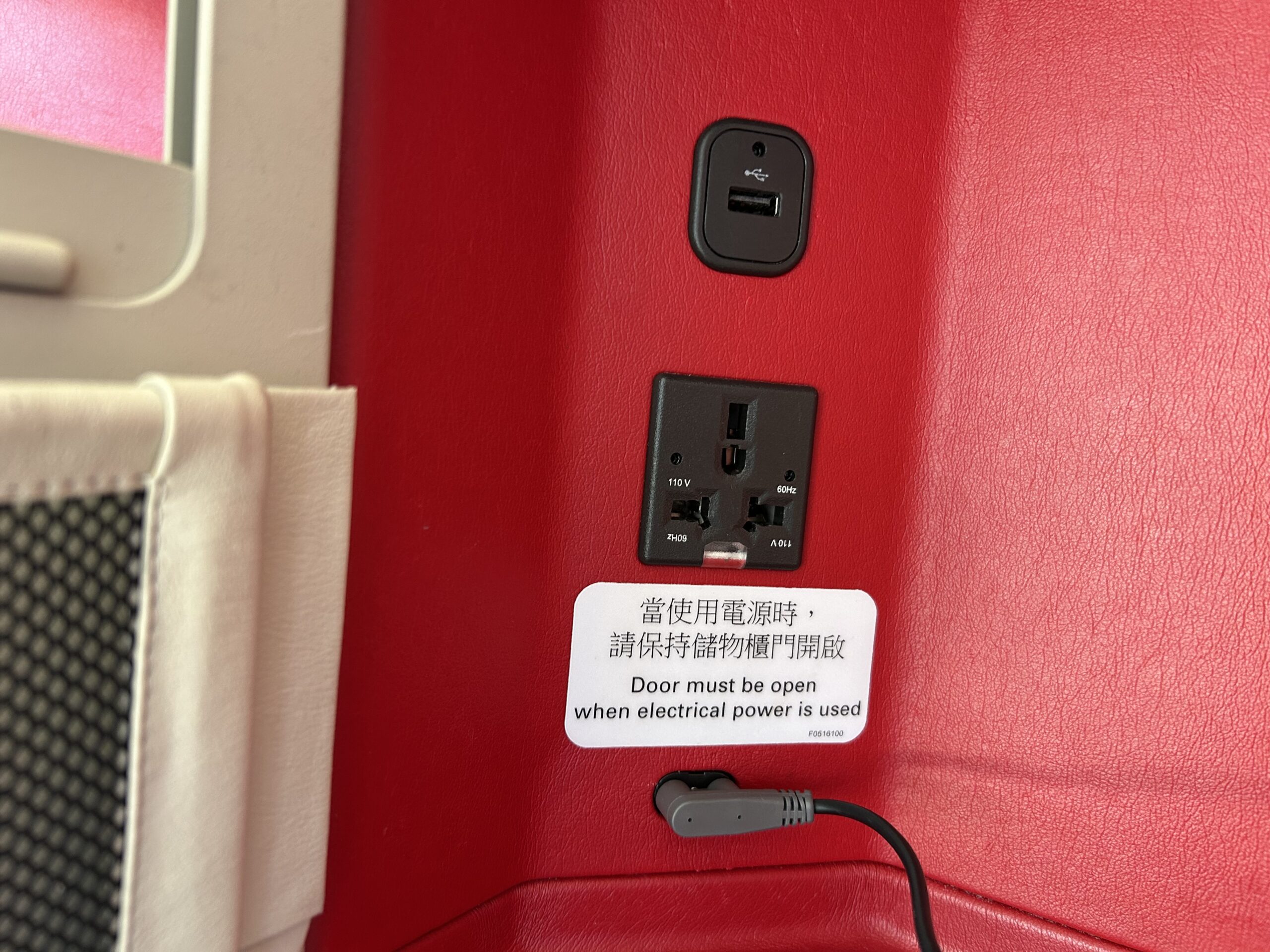 outlets and a USB port at a business class seat