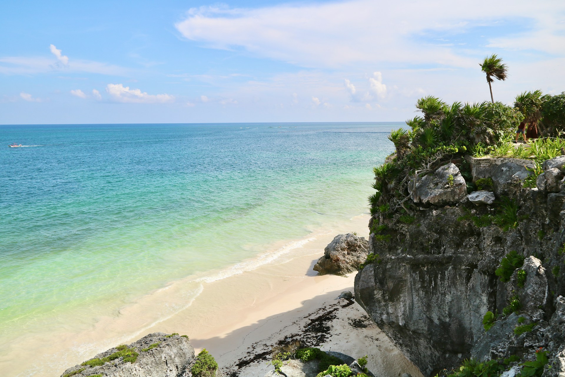 a white sand beach with cliffs