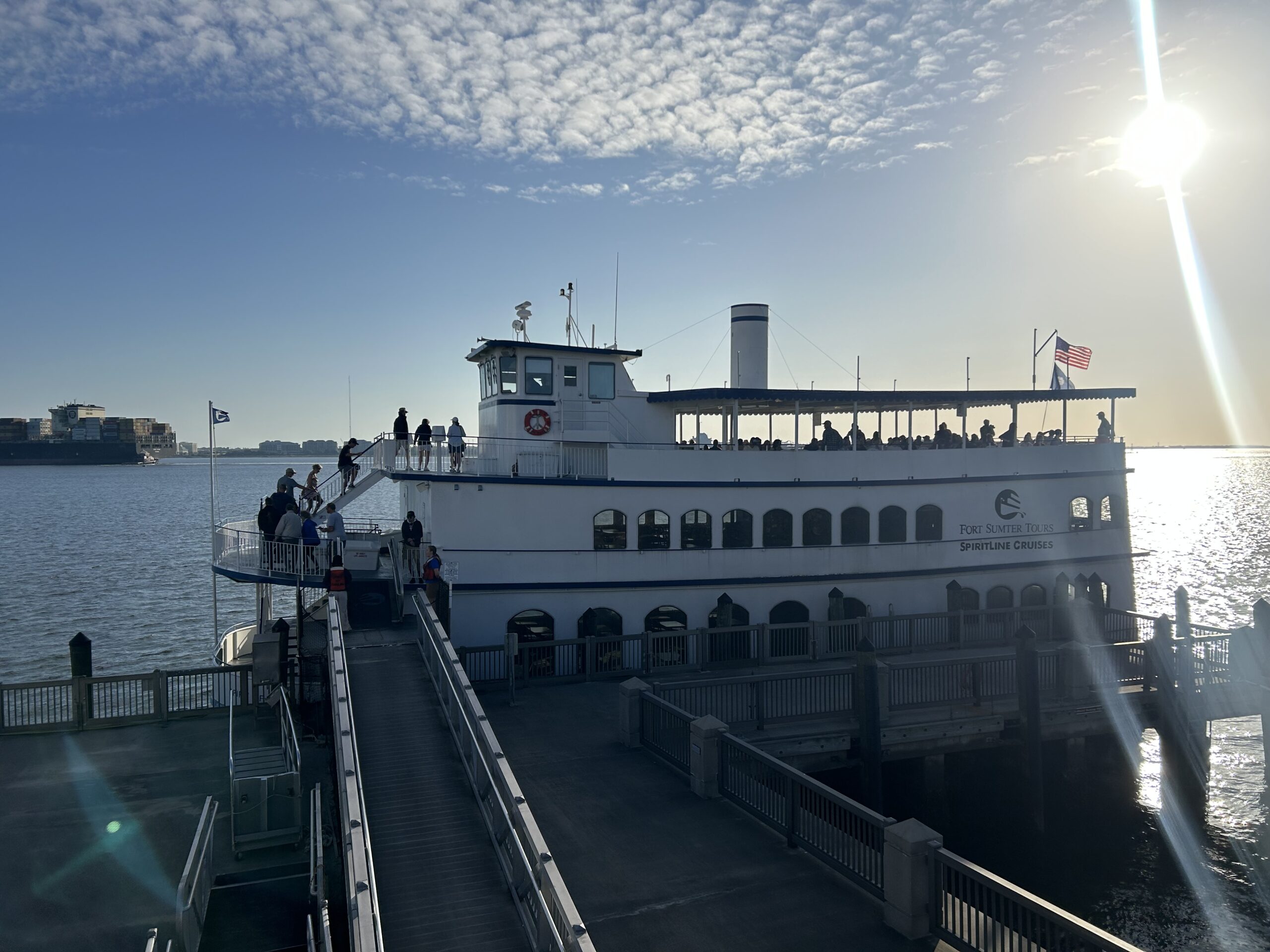 three-story ferry boat being boarded in the morning sun in Charleston, South Carolina