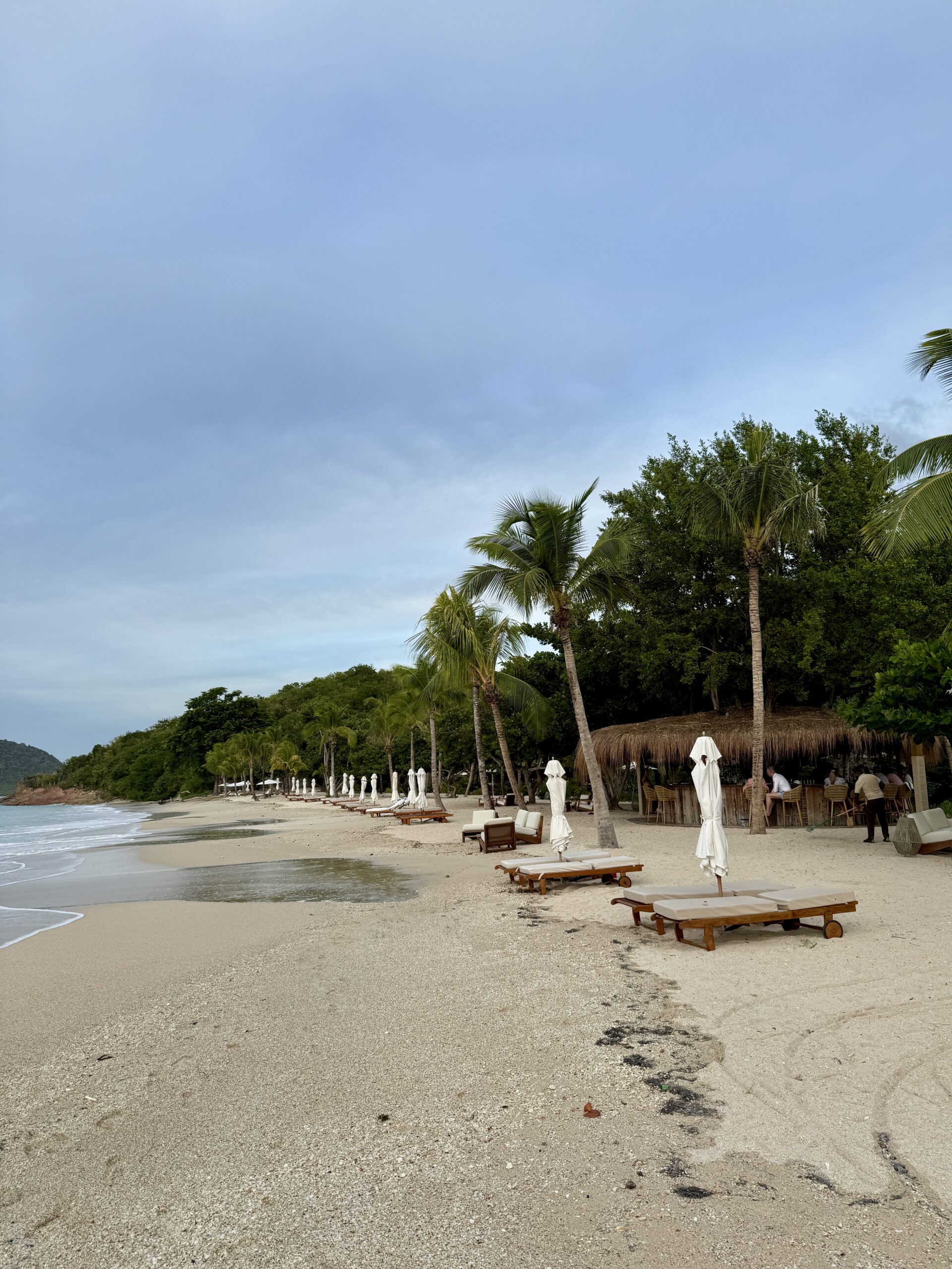 beach chairs and umbrellas along the coastline