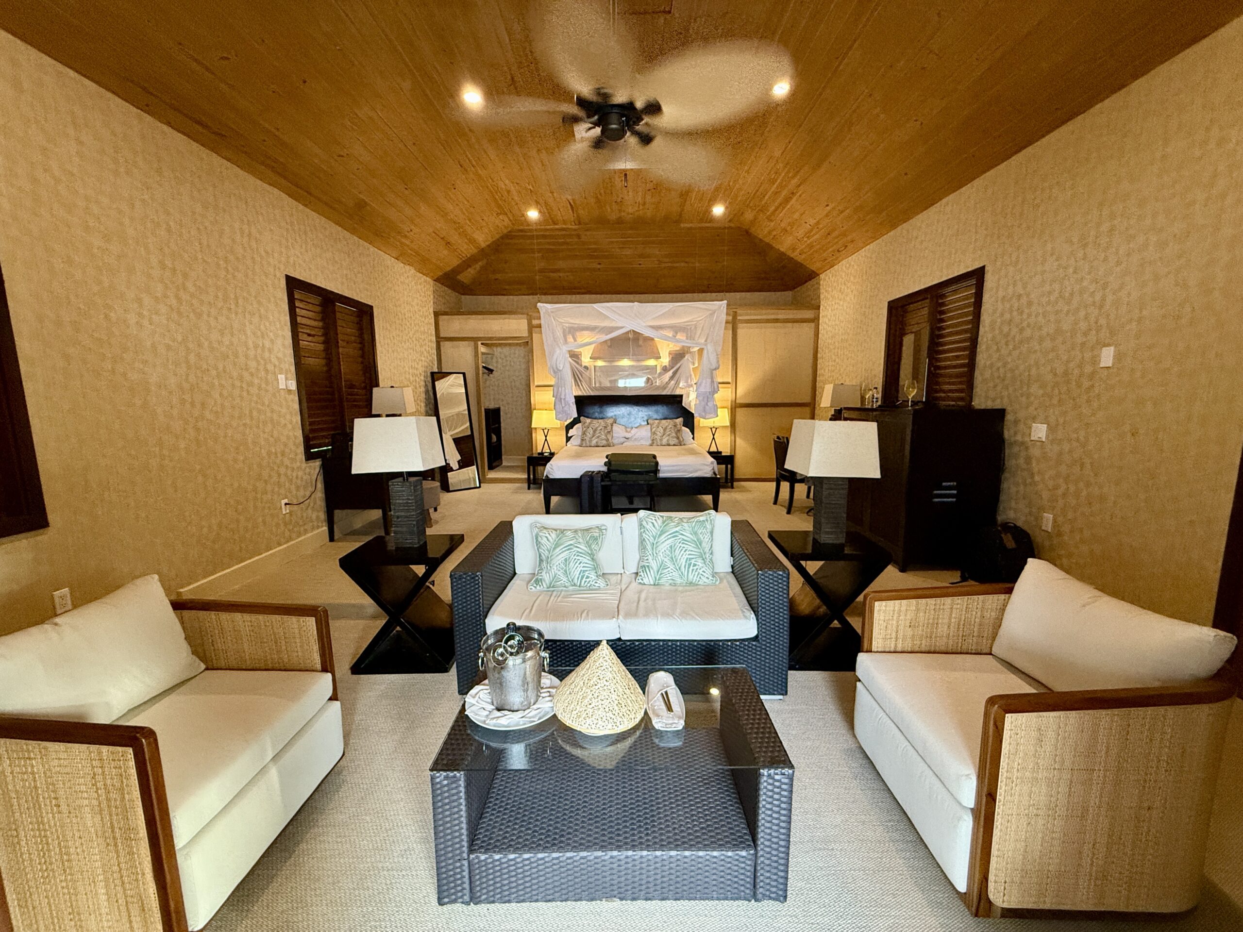 bedroom with a fan spinning overhead in vaulted ceilings