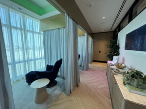 cozy blue chairs inside of an airport lounge 