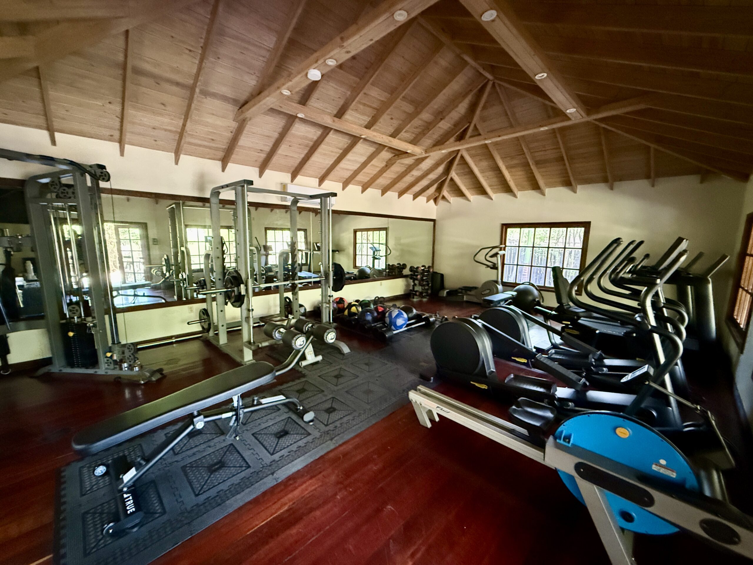 a small gym with several workout machines