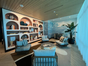 library with cozy seating and a decorative wall