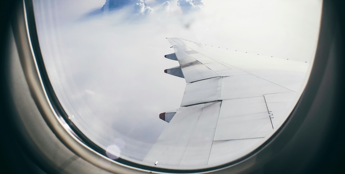 view of an airplane wing from an airplane window