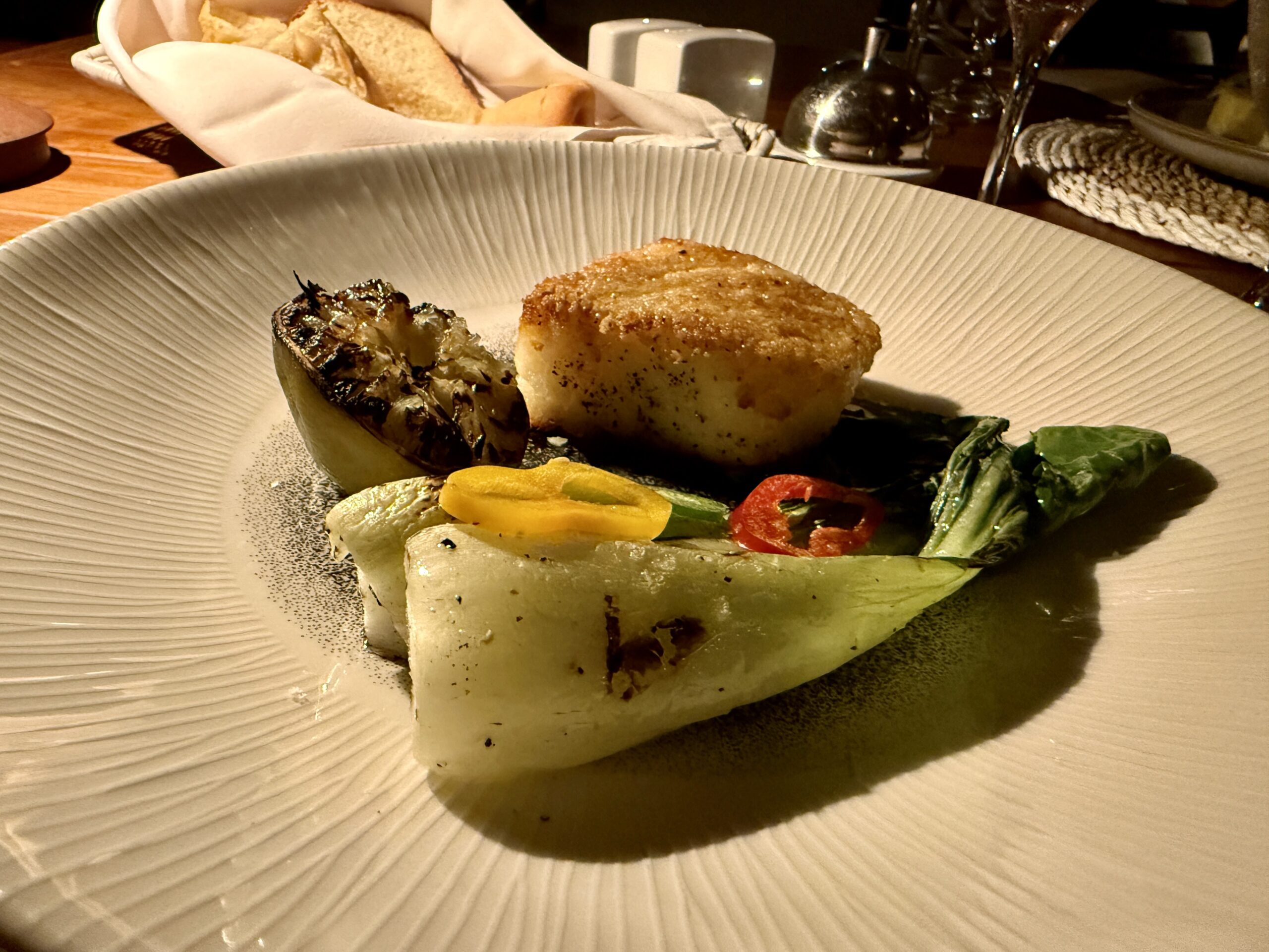 sea bass on a plate with bok choy 