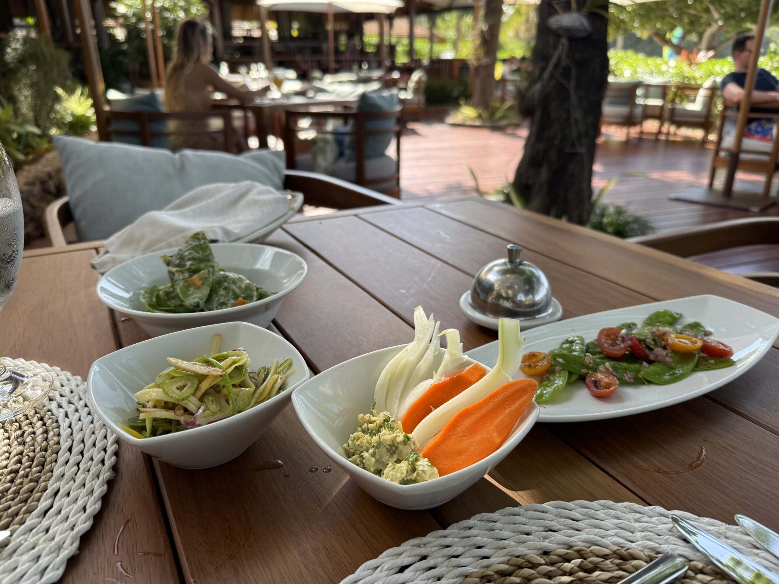 several small dishes of vegetables