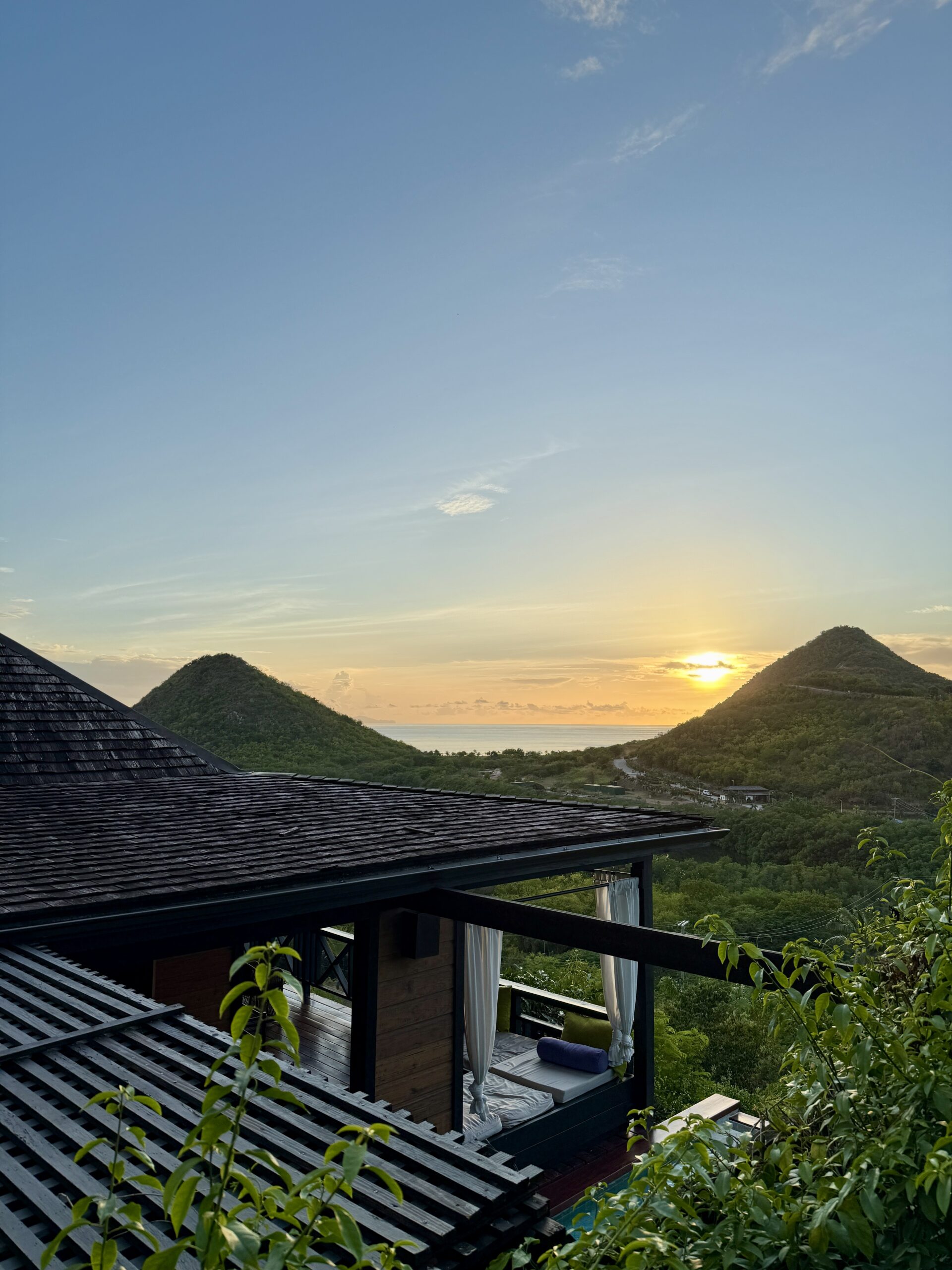view of the hills and ocean from a hillside villa