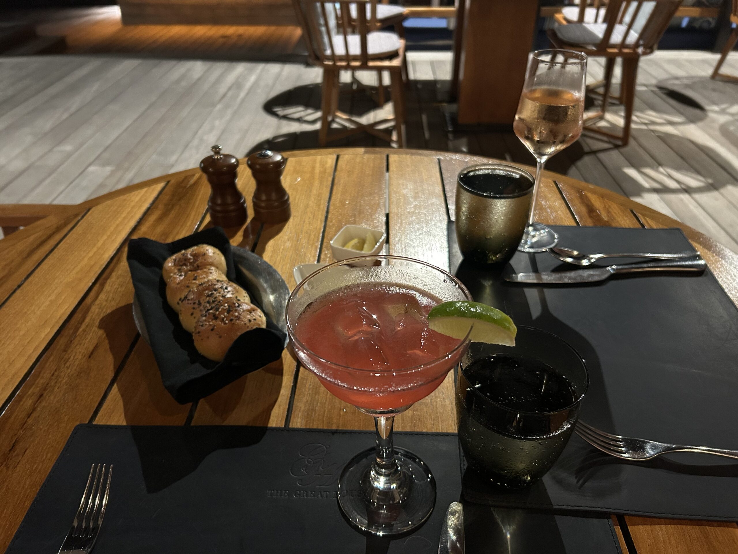 a pink cocktail and a glass of rose 