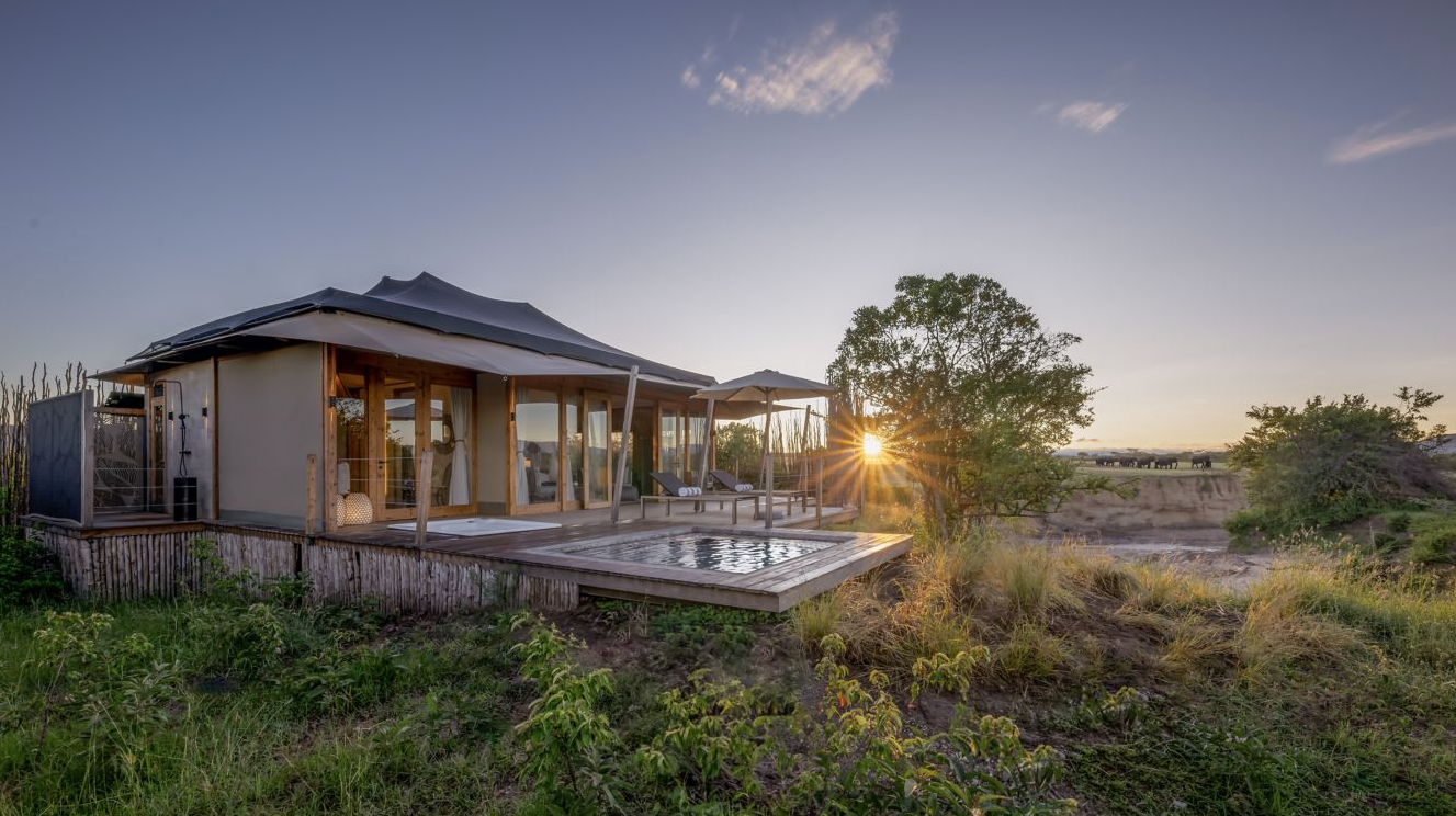a tented hotel suite on the savanna with a private pool 