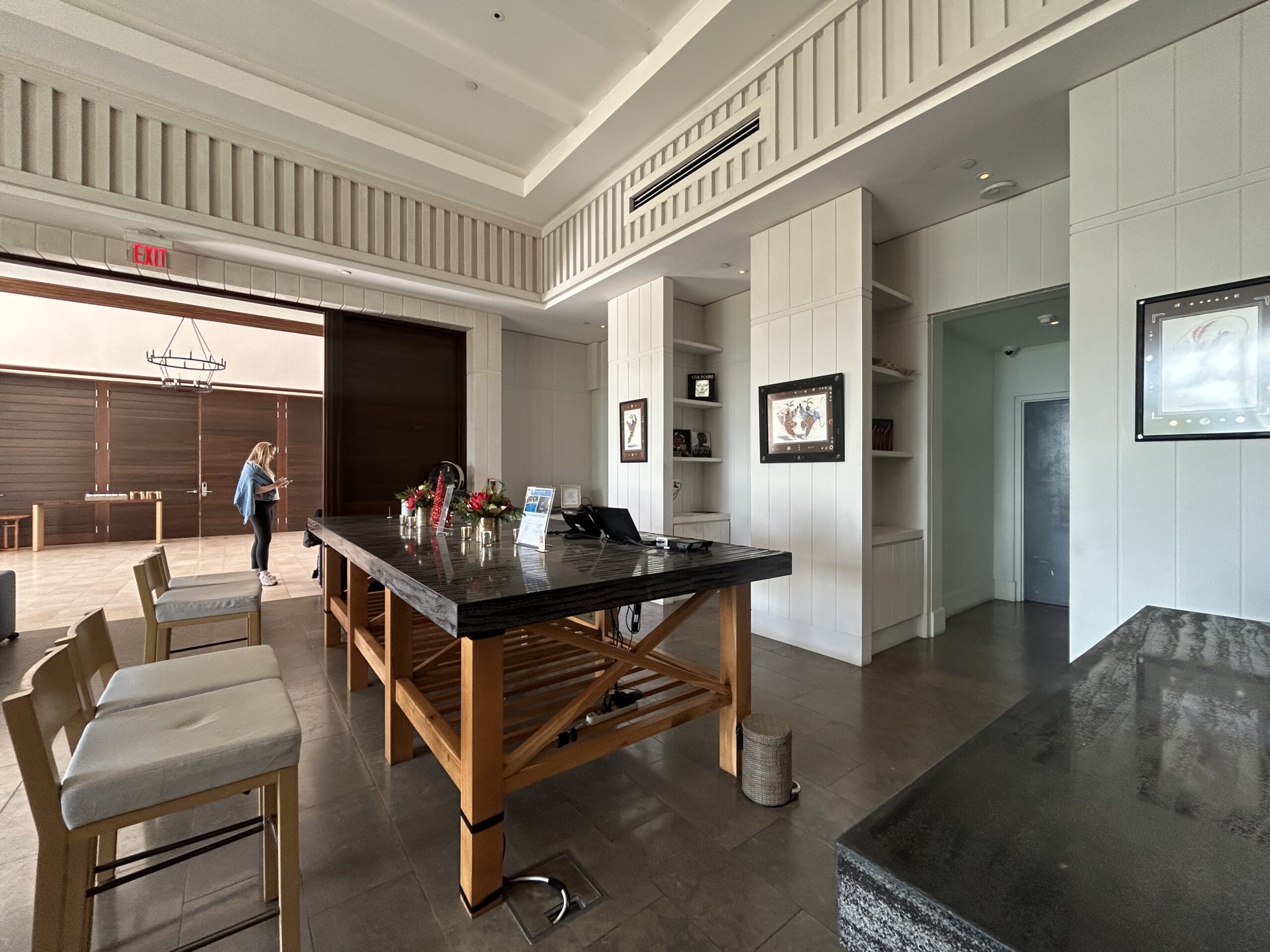 four chairs and a long table at the reception area at the Park Hyatt St. Kitts 