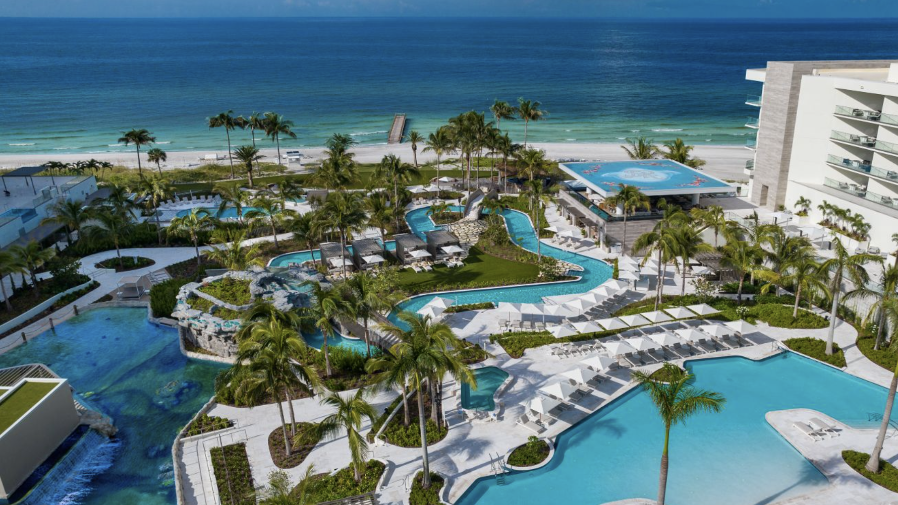 The St. Regis Longboat Key Resort pool with the ocean in the background