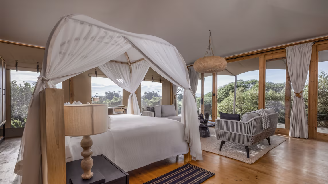 hotel room with a large bed with curtains