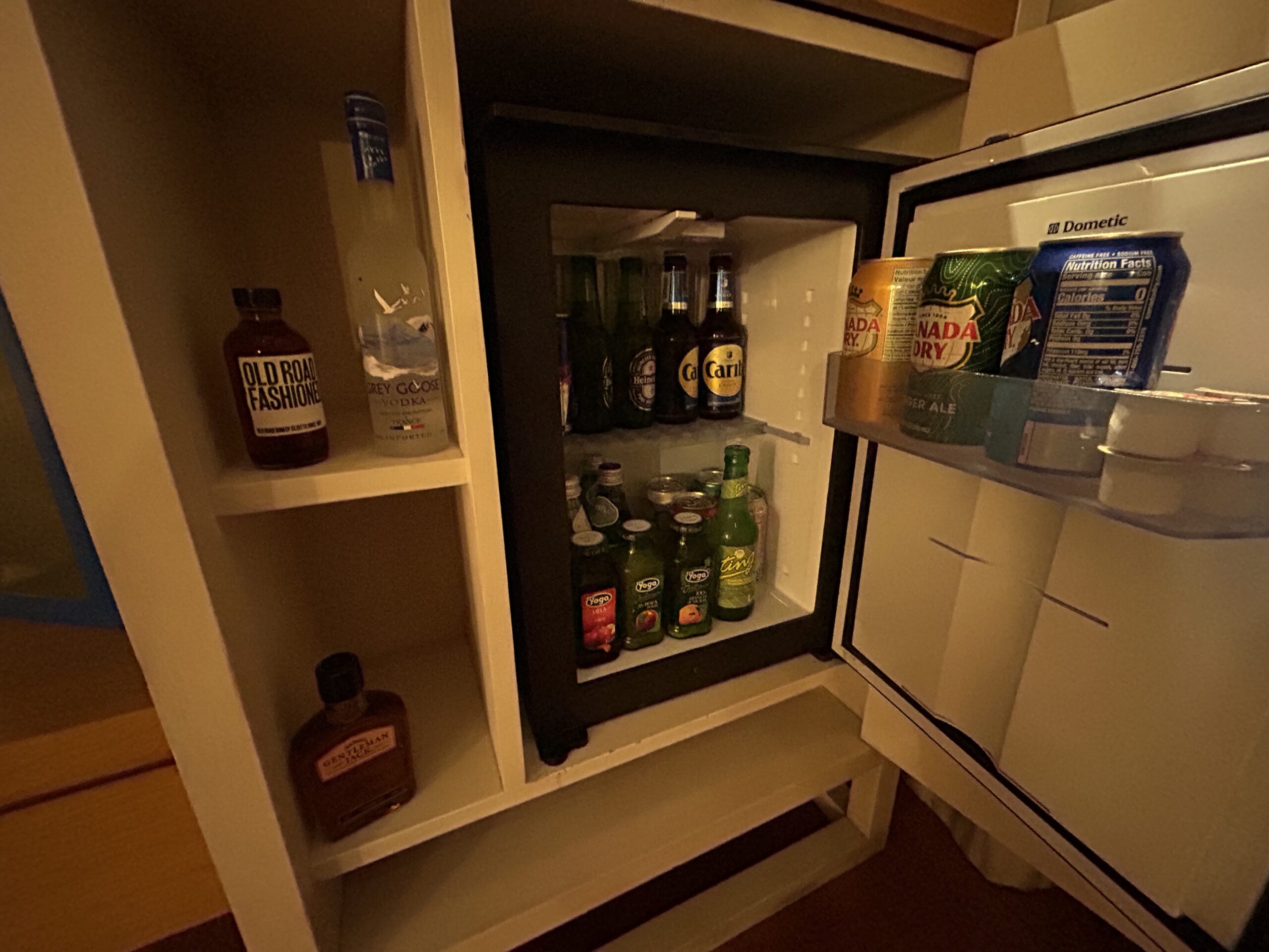 minibar stocked with soft drinks, beer and liquor