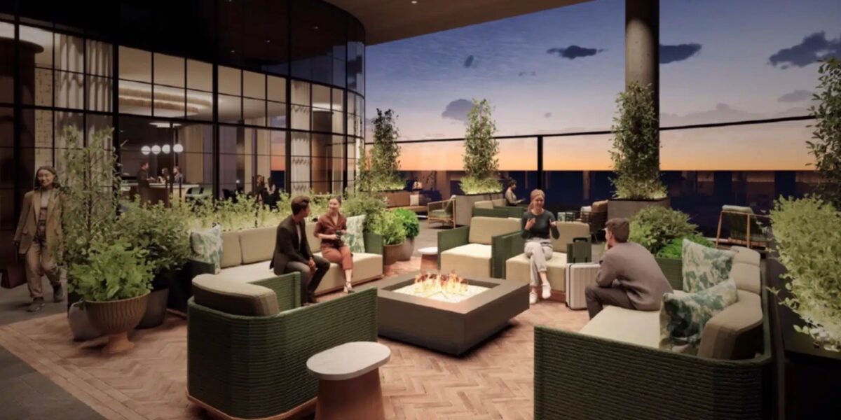 people sitting on an outdoor terrace at an airport