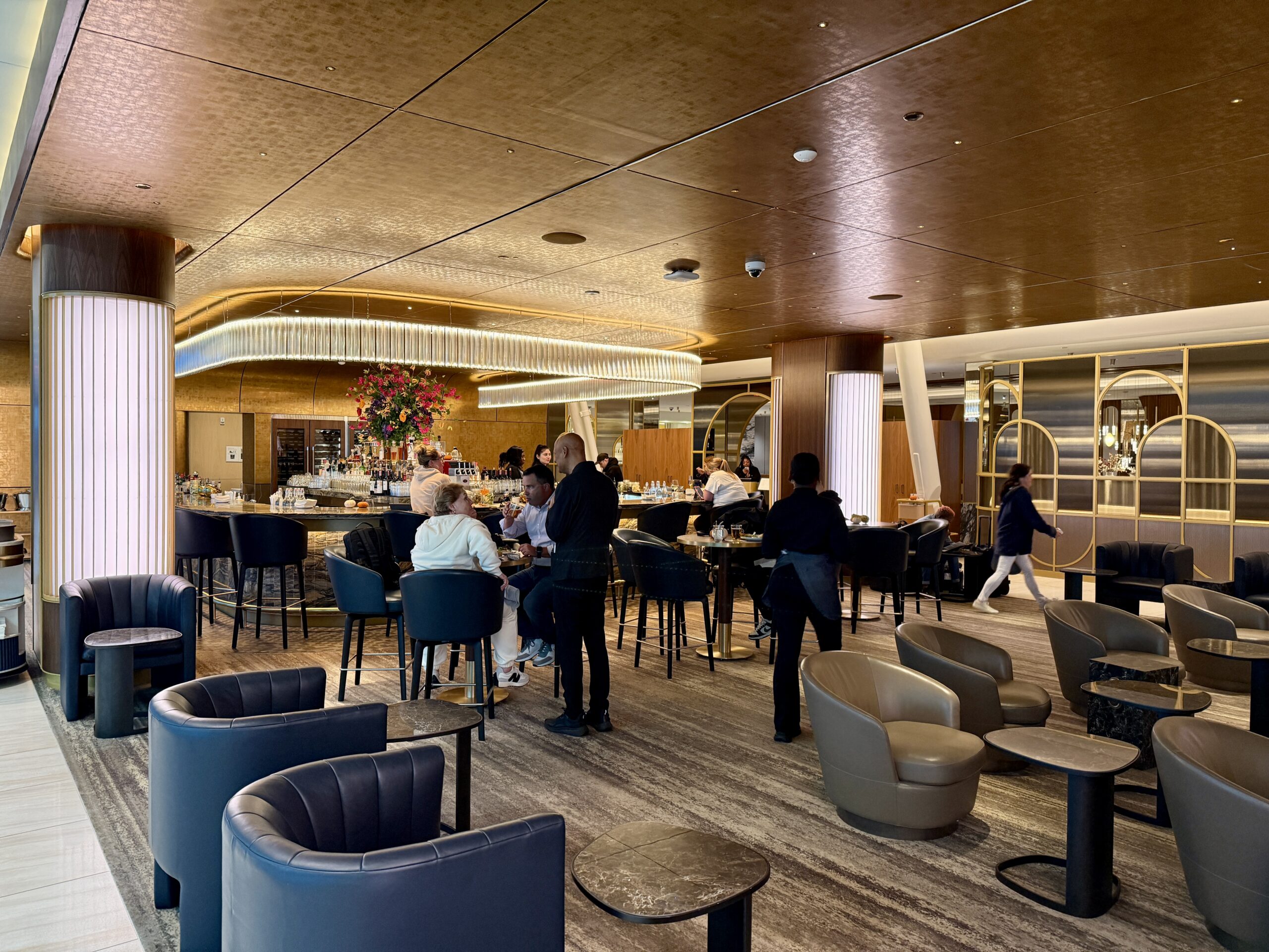 bar with people standing around and seating