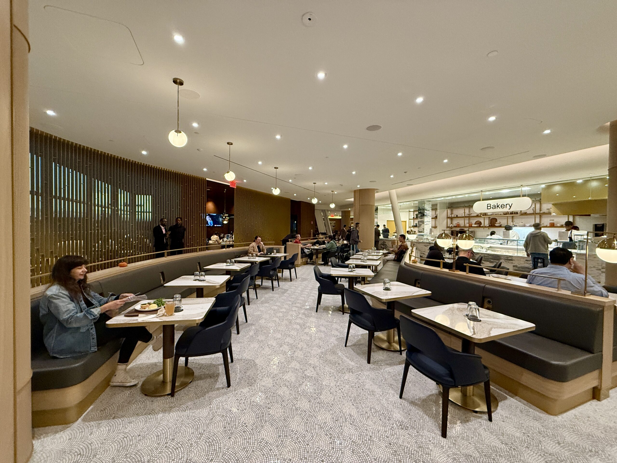 delta one lounge dining room with people at tables